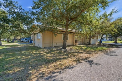 Cute mobile home with a new engineered roof placed over home - photo 3