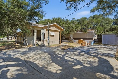 Cute mobile home with a new engineered roof placed over home - photo 5