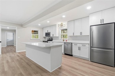 Welcome to this beautifully renovated brick ranch nestled on a - photo 18