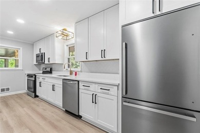 Welcome to this beautifully renovated brick ranch nestled on a - photo 19