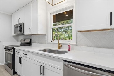 Welcome to this beautifully renovated brick ranch nestled on a - photo 20