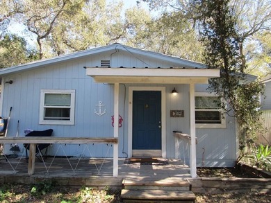 Hang up your fishing poles and settle into this charming coastal - photo 1