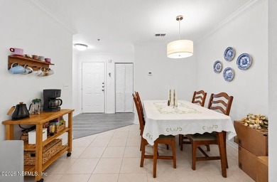 Welcome home to this bright, move-in ready condo in the gated - photo 5
