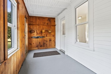 Welcome to 675 River Road, a rare riverside property set on - photo 9