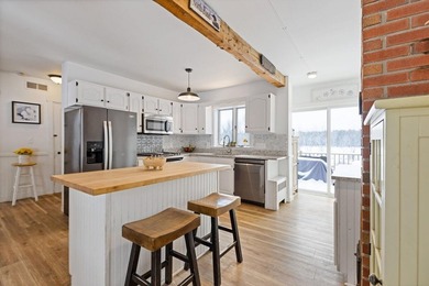 Welcome to 675 River Road, a rare riverside property set on - photo 10