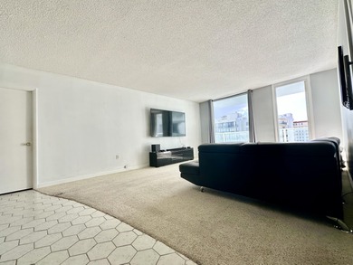 The oceanfront two-bedroom, two-bath residence combines a highly