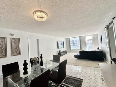 The oceanfront two-bedroom, two-bath residence combines a highly