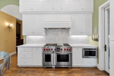 Beautiful nearly new custom built brick & stone home overlooking