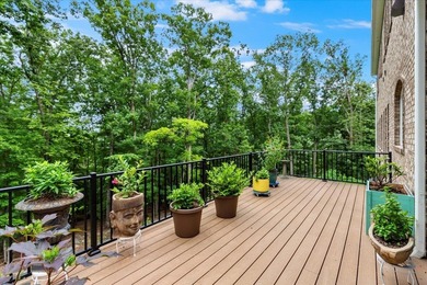 Beautiful nearly new custom built brick & stone home overlooking