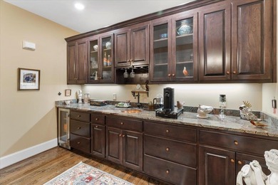 Beautiful nearly new custom built brick & stone home overlooking