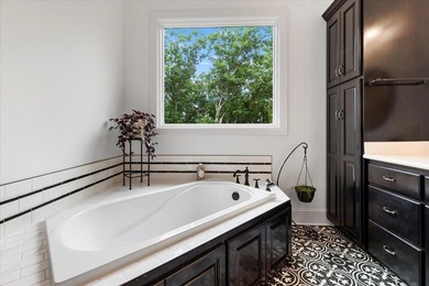 Beautiful nearly new custom built brick & stone home overlooking