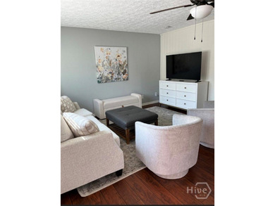 Welcome to this updated, 3 bedroom, 2.5 bath brick townhome. The - photo 3