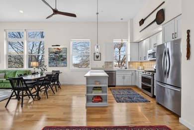 Filled with light, this end-unit condo feels like a private