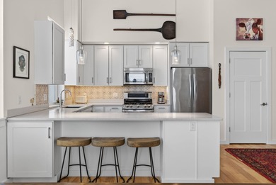 Filled with light, this end-unit condo feels like a private