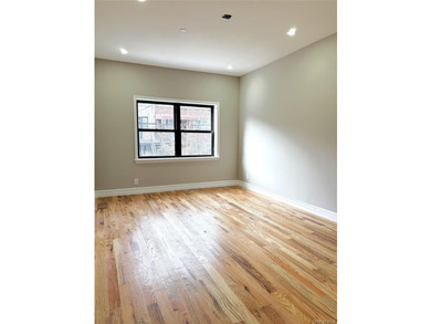 Experience modern luxury in this fully renovated two-family - photo 6