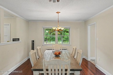 Situated on a quiet cul-de-sac in the heart of Diamondhead, this - photo 6