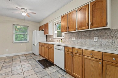 Situated on a quiet cul-de-sac in the heart of Diamondhead, this - photo 8