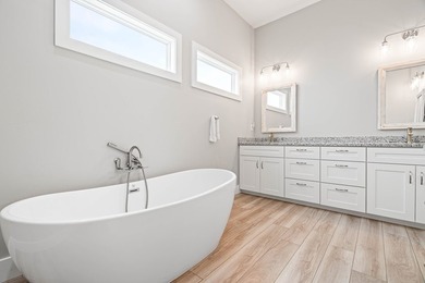 Welcome to this spacious, newly built home located in the - photo 33