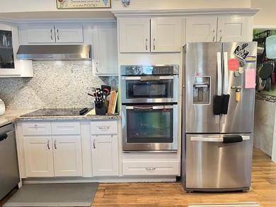 Charming home in a desirable neighborhood, featuring a gated - photo 4