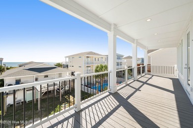 Step into coastal luxury with this furnished beach home that