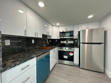 This beautifully and completely updated top floor, split bedroom