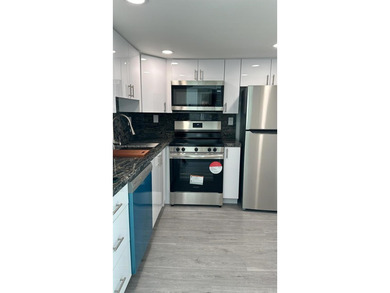 This beautifully and completely updated top floor, split bedroom