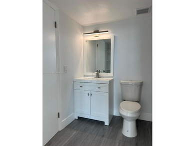 This beautifully and completely updated top floor, split bedroom