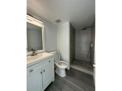 This beautifully and completely updated top floor, split bedroom