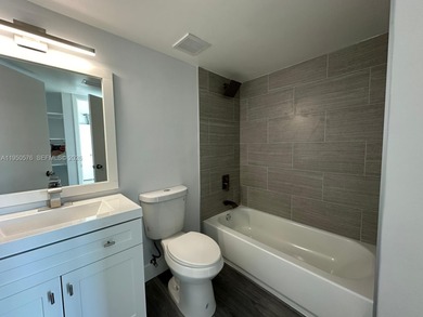 This beautifully and completely updated top floor, split bedroom