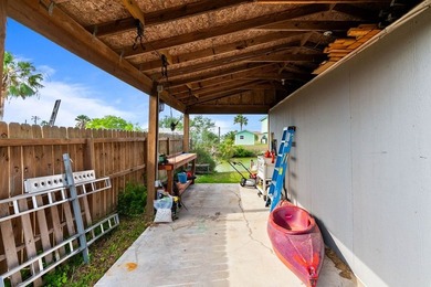 Don't miss this canal-front, Texas gem in Copano Cove. Framed by - photo 12