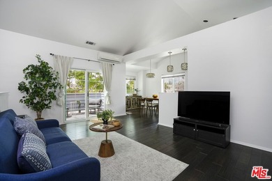 Welcome to this bright and stylish corner-unit 2-bedroom, 2-bath - photo 1