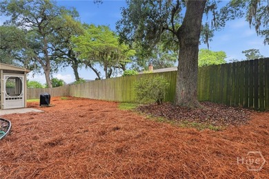 Tucked beneath the sweeping limbs of century-old oaks, this Isle - photo 25
