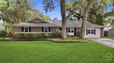 Tucked beneath the sweeping limbs of century-old oaks, this Isle - photo 31