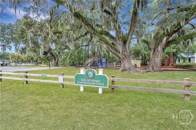 Tucked beneath the sweeping limbs of century-old oaks, this Isle - photo 33