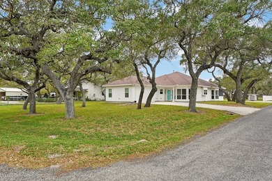 Nestled on a nicely landscaped spacious .66-acre corner lot in - photo 2