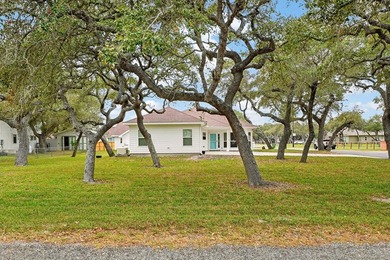 Nestled on a nicely landscaped spacious .66-acre corner lot in - photo 3