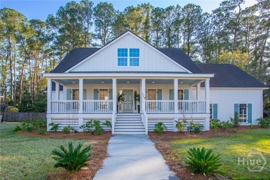 This exceptional Isle of Hope residence offers refined living on - photo 2