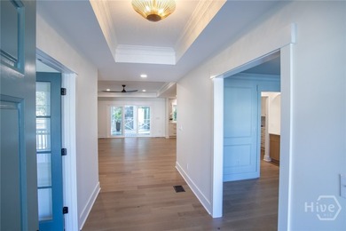 This exceptional Isle of Hope residence offers refined living on - photo 4