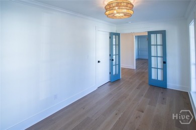 This exceptional Isle of Hope residence offers refined living on - photo 6