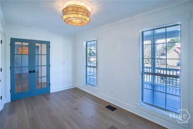 This exceptional Isle of Hope residence offers refined living on - photo 7