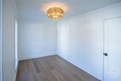 This exceptional Isle of Hope residence offers refined living on - photo 9