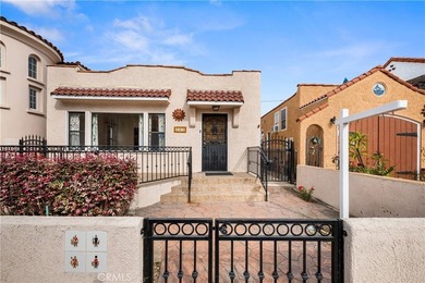 This 1924 low profile Spanish bungalow is located in one of the - photo 1