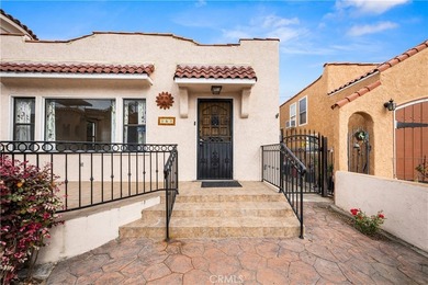 This 1924 low profile Spanish bungalow is located in one of the - photo 5