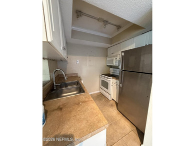 Rehab needed on this original 1 bedroom/ 1 bath end unit - photo 4