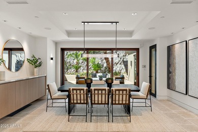 Perched high in the prestigious Tatum Canyon, this modern