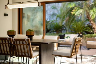 Perched high in the prestigious Tatum Canyon, this modern