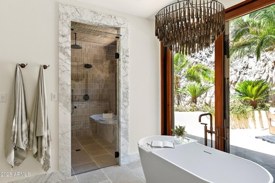 Perched high in the prestigious Tatum Canyon, this modern