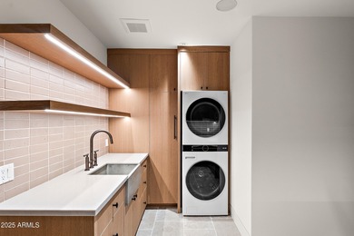 Perched high in the prestigious Tatum Canyon, this modern