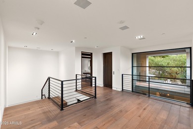 Perched high in the prestigious Tatum Canyon, this modern