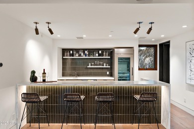 Perched high in the prestigious Tatum Canyon, this modern